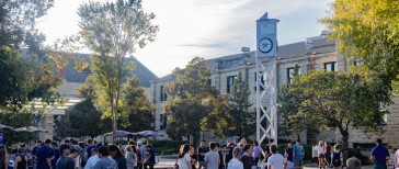 Students engaging with student organizations on Bosco Student Plaza