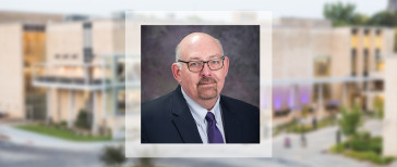 Craig Johnson headshot with the Union as the background