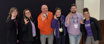 K-State Student Union staff and Mike Finnegan pose for a photo at Oklahoma State University