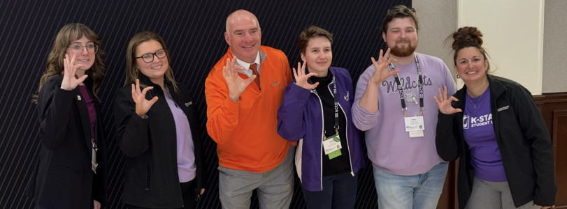 K-State Student Union staff and Mike Finnegan pose for a photo at Oklahoma State University
