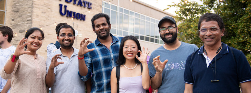 A group of people standing outside in front of the Union 