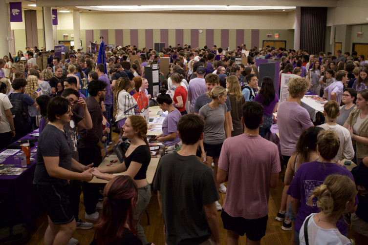 MarketingTablesBallroom Students gathered in Union Ballroom, browsing marketing tables.