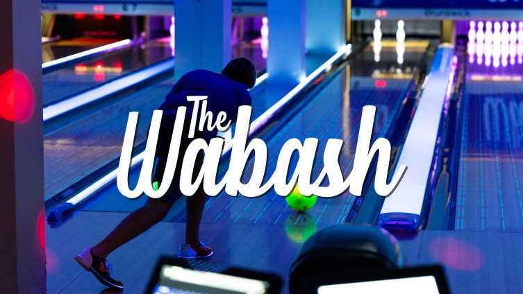 A student bowling at The Wabash at the Union.